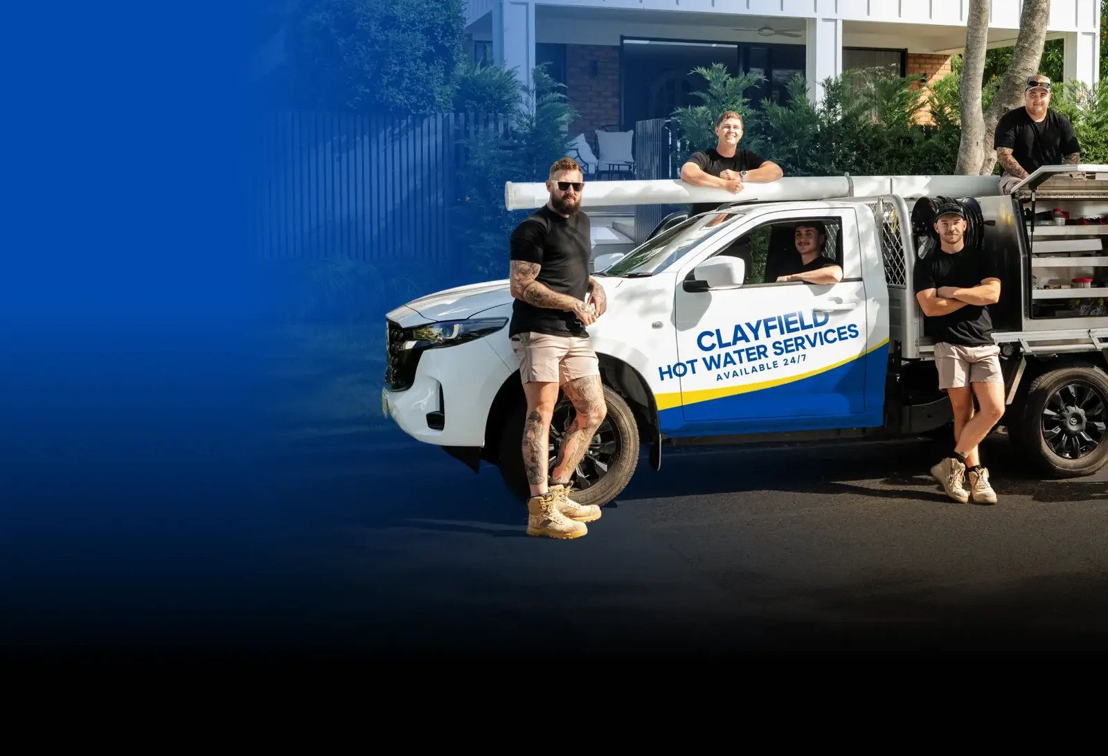 Clayfield Hot Water Services team with the ute